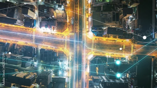 Street intersection at night with modern data visualization overlays displaying analytics and infographics as smart city concept