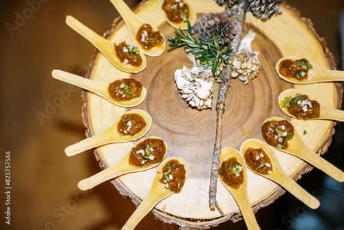 overhead shot of Hors d'oeuvre appetizer on wooden slab photo