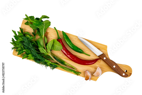 Vegetables on cutting board top view isolated on white