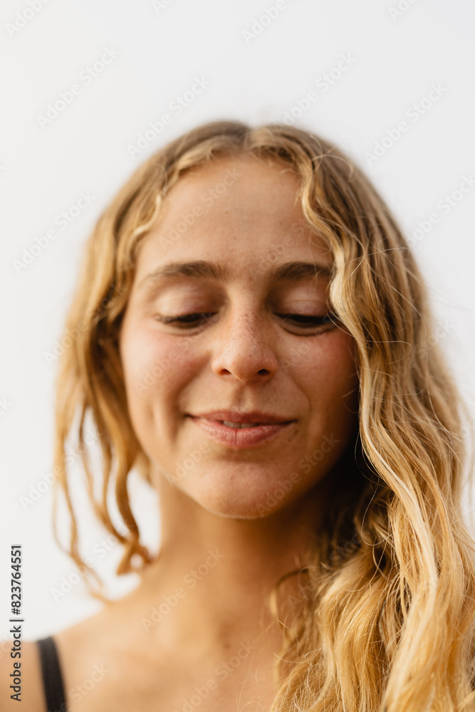 portrait of a woman with natural wavy blonde hair portrait of a woman with natural wavy blonde hair