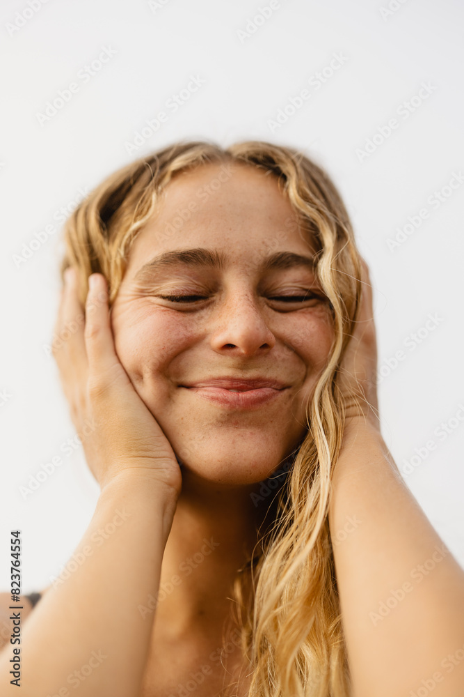 portrait of a happy woman with natural wavy blonde hair portrait of a happy woman with natural wavy blonde hair