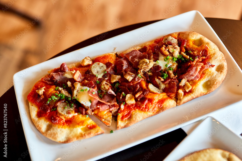 Breakfast Savory Flatbread Plated at Restaurant Table Breakfast Savory Flatbread Plated at Restaurant Table