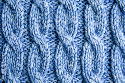 Light blue knitted background. Knitting pattern
