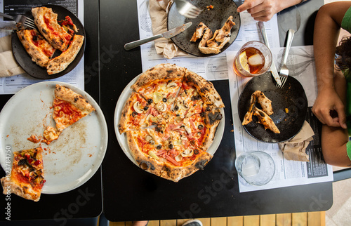 Overhead view of pizza on restaurant table