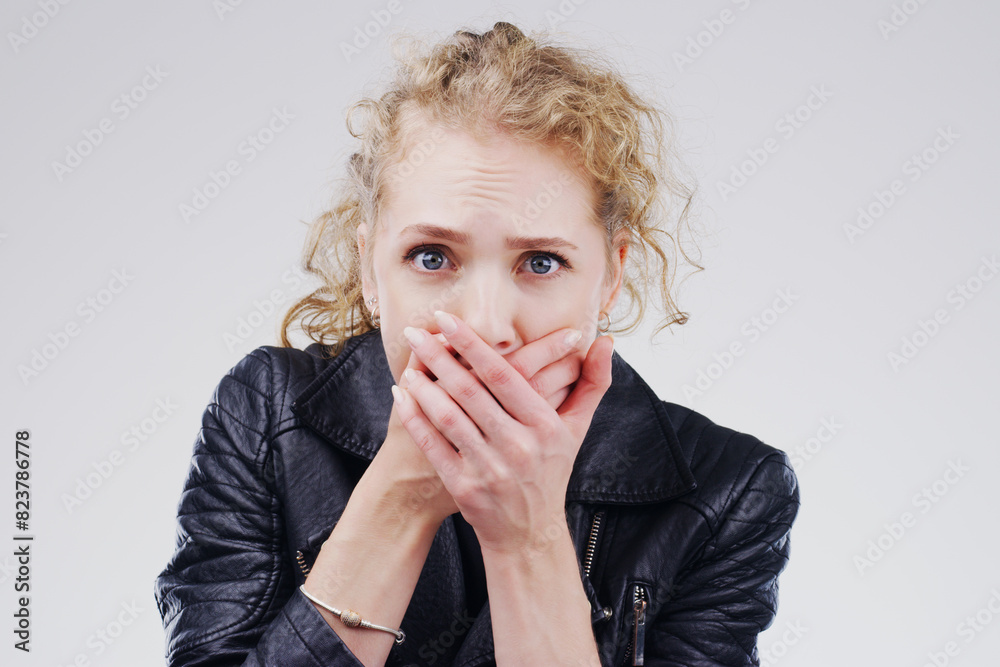 Woman, shocked and portrait in studio for drama, horror and secret on white background. Surprise, alarm and female person with hands on face for wow, omg and reaction to meme or story in Australia