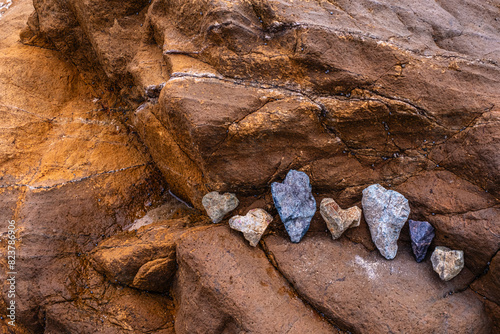 A grouping of heart-shaped rocks on a rocky outcropping photo