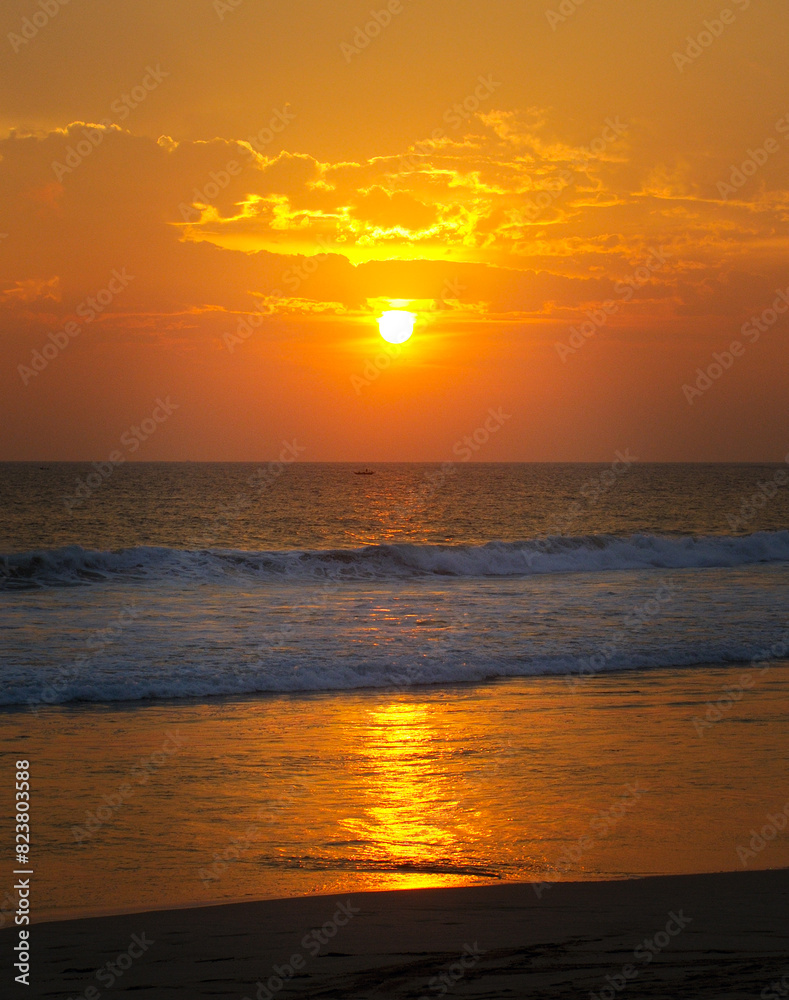 Sea and bright Sunrise on sky .Vertical photo