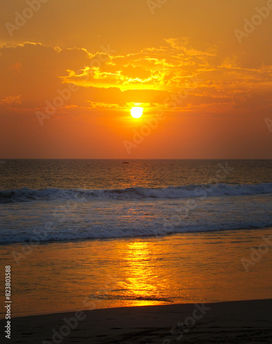 Sea and bright Sunrise on sky .Vertical photo