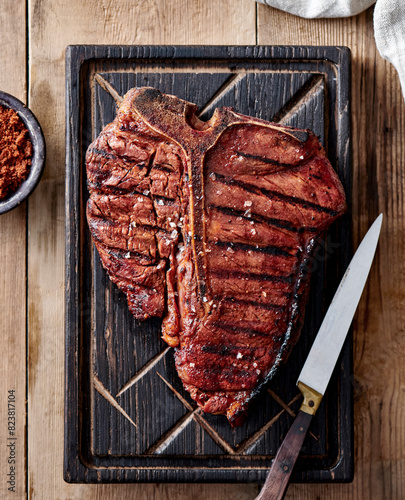 T-bone steak on a serving board