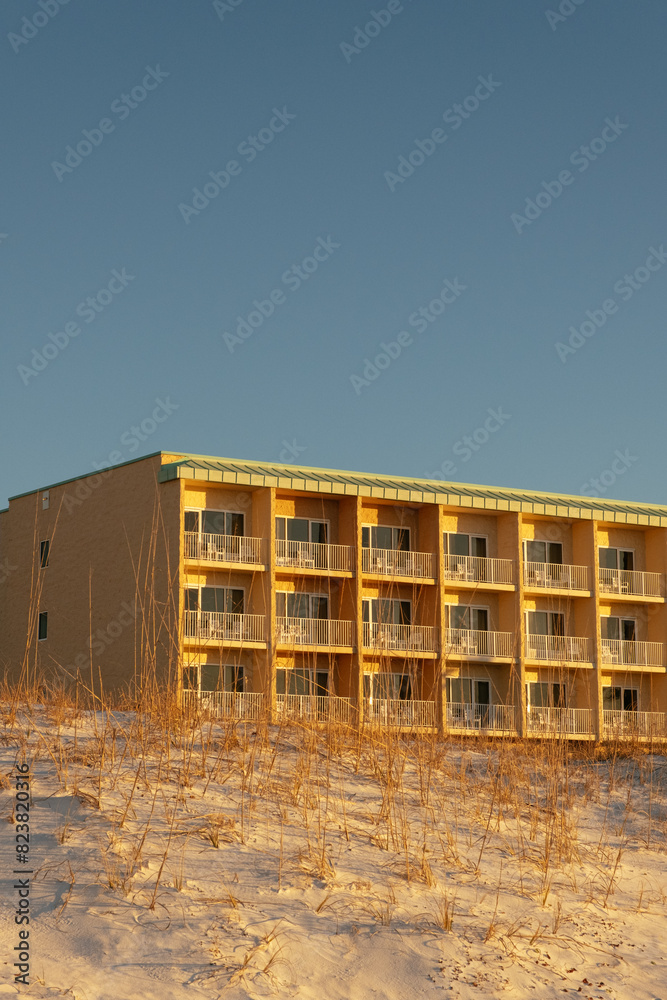 Sunny Florida Beach Hotel Exterior with Blue Sky Copyspace Sunny Florida Beach Hotel Exterior with Blue Sky Copyspace