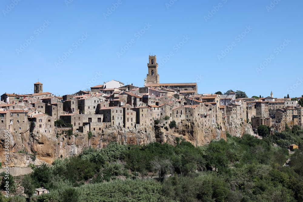 Pitigliano - the picturesque medieval town founded in Etruscan time on the tuff hill in Tuscany, Italy. Pitigliano - the picturesque medieval town founded in Etruscan time on the tuff hill in Tuscany, Italy.