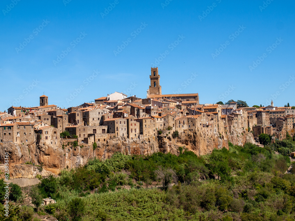 Pitigliano - the picturesque medieval town founded in Etruscan time on the tuff hill in Tuscany, Italy. Pitigliano - the picturesque medieval town founded in Etruscan time on the tuff hill in Tuscany, Italy.