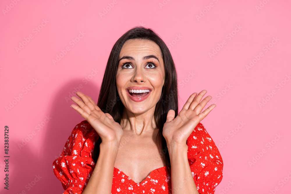 Portrait photo of surprised funny young lady touching cheeks unexpected sale looking above head isolated on pink color background Portrait photo of surprised funny young lady touching cheeks unexpected sale looking above head isolated on pink color background