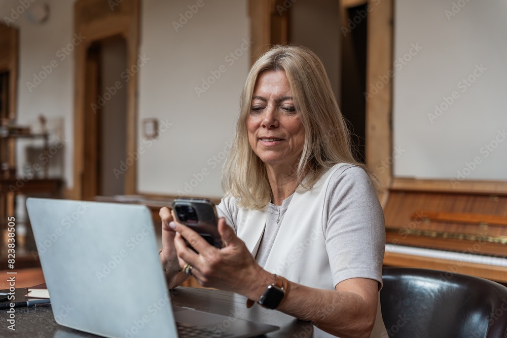 Portrait Of A Mature Woman Working Indoors. Portrait Of A Mature Woman Working Indoors.