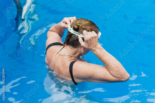 Senior woman getting ready to swim photo