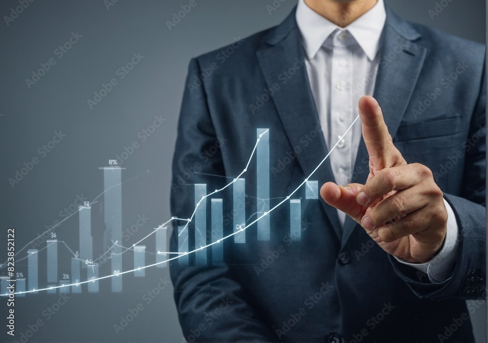 A businessman's plan graph shows how his firm is growing and increasing good signs. A businessman's plan graph shows how his firm is growing and increasing good signs.