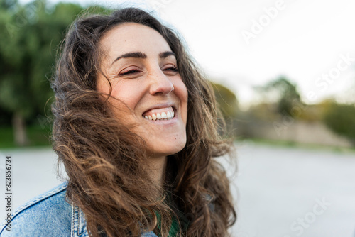 Close-up portrait of smiling woman photo