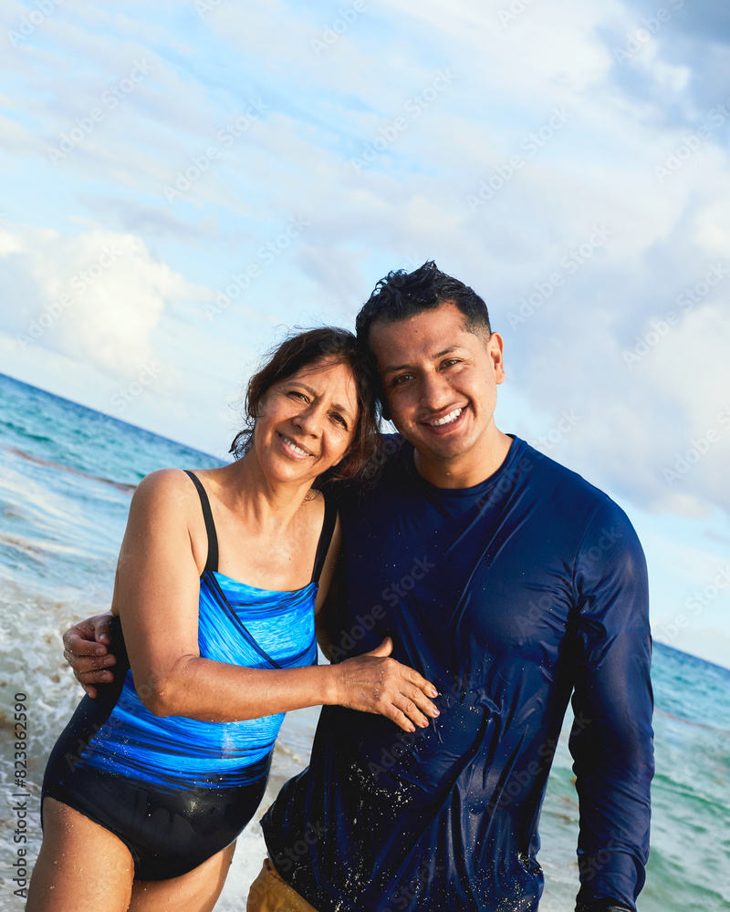 A mother and her son are enjoying the beach together. A mother and her son are enjoying the beach together.