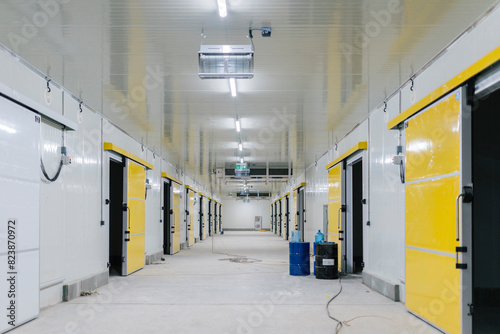 Illuminated empty corridor of modern new building photo