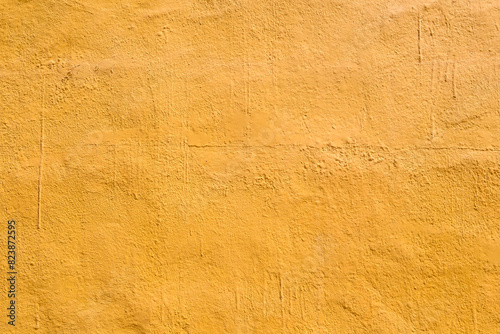 Textured yellow wall surface