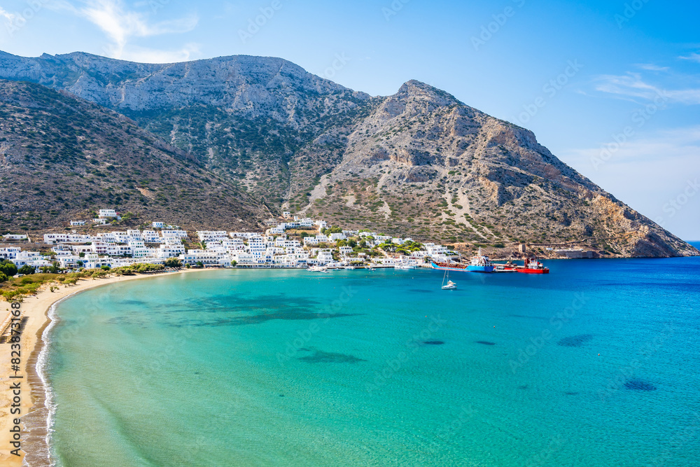 View of Kamares port sea bay and village in mountain landscape, Sifnos island, Greece