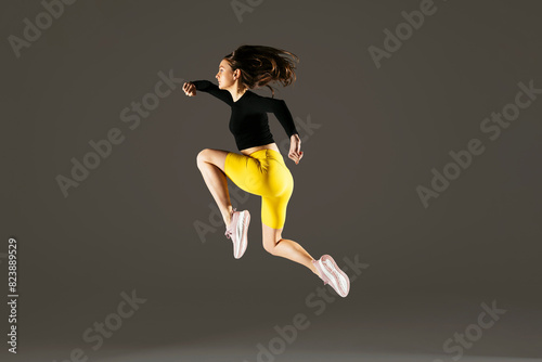 Woman jumping in studio