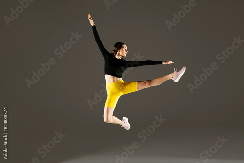 Woman jumping in studio