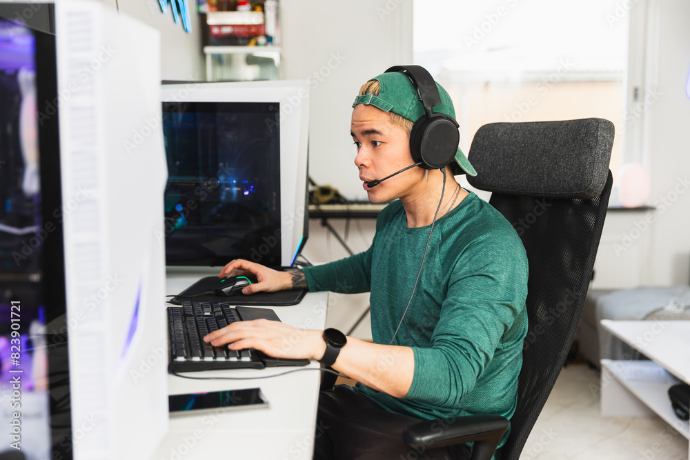 Focused gamer enjoying live stream gaming Focused gamer enjoying live stream gaming