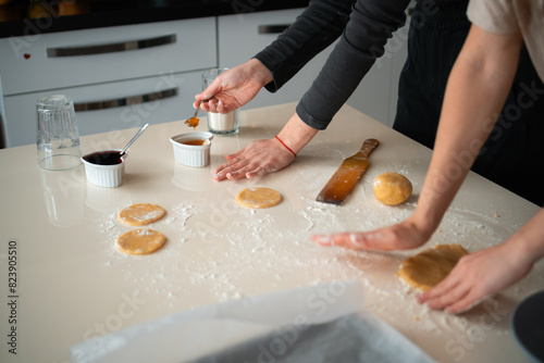 Hands Turn dough out and add jam