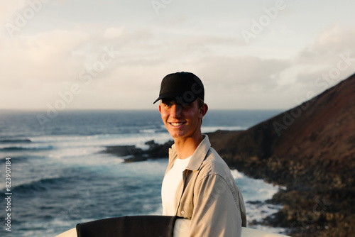 A surfer smiling because he found the right tide to surf photo