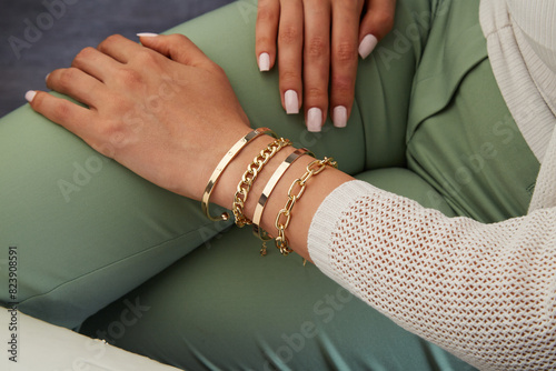 Gold jewelry. Gold bracelet on woman hand