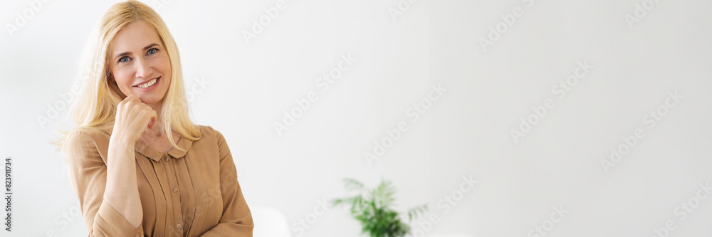 Success Conception. Mature Business Lady At Her Workplace In Office, Looking At Camera, Free Space, Web-banner Success Conception. Mature Business Lady At Her Workplace In Office, Looking At Camera, Free Space, Web-banner