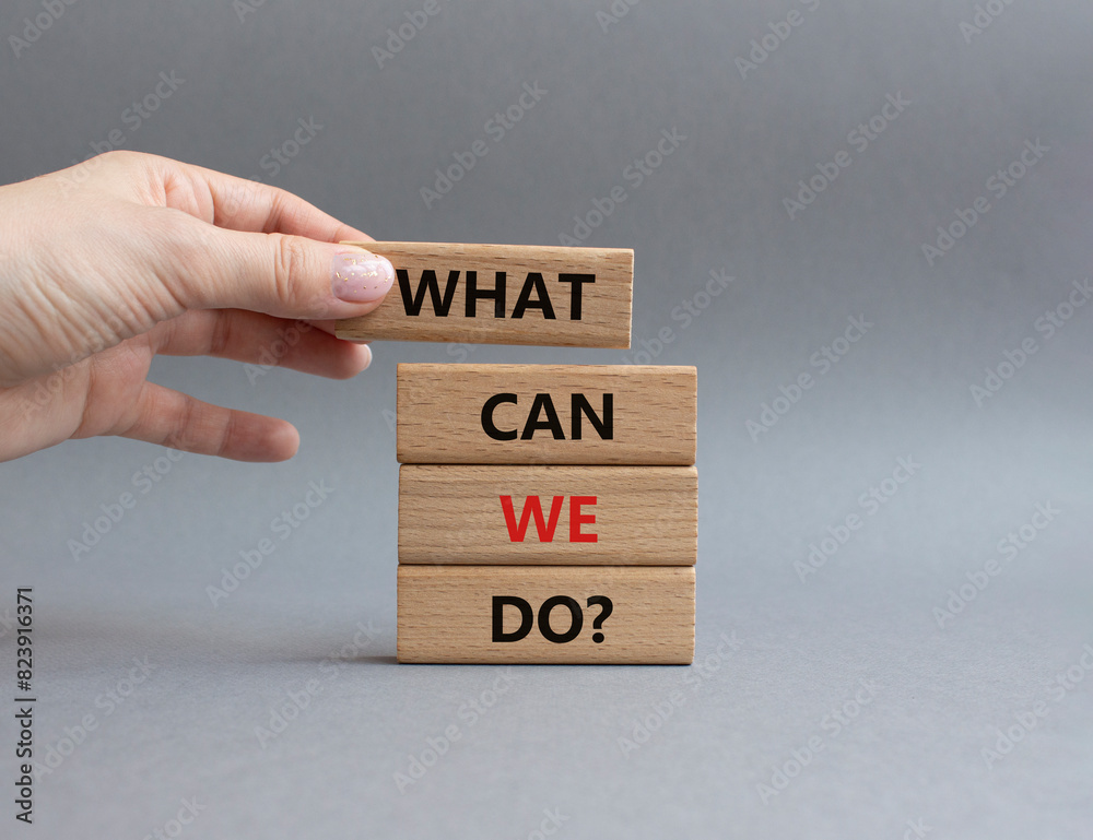What can we do symbol. Wooden blocks with words What can we do. Businessman hand. Beautiful grey background. Business and What can we do concept. Copy space. What can we do symbol. Wooden blocks with words What can we do. Businessman hand. Beautiful grey background. Business and What can we do concept. Copy space.