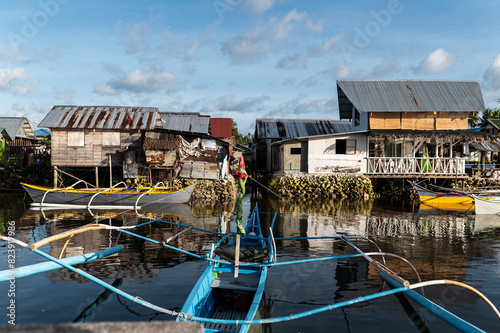 Fisherman harbor close to stilt houses photo