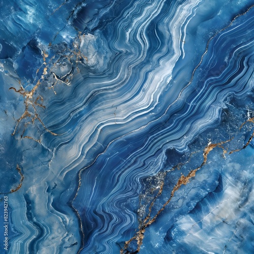 A detailed shot of a blue marble slab, showcasing the depth of its ocean-like patterns and swirling hues, under the clear, bright noon light.