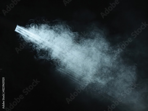 light beam and smoke on black background