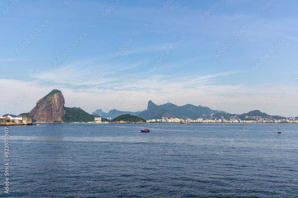 Panoramic view of the city of Rio de Janeiro, with the mountains of Sugarloaf Mountain and Christ the Redeemer in the background, Guanabara Bay Panoramic view of the city of Rio de Janeiro, with the mountains of Sugarloaf Mountain and Christ the Redeemer in the background, Guanabara Bay
