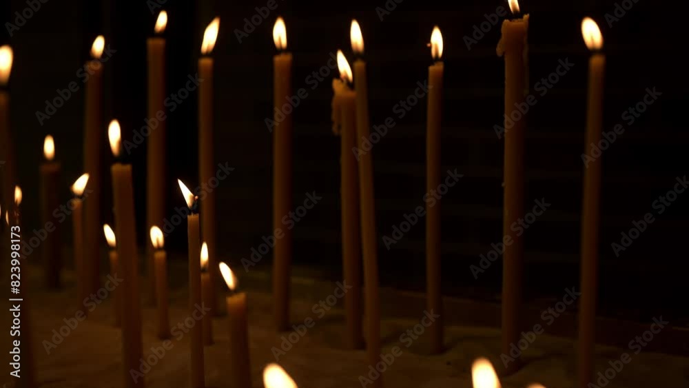 Candles burning in a Greek Orthodox Church symboling prayer, faith, light, hope, and worship, 4k horizontal video Candles burning in a Greek Orthodox Church symboling prayer, faith, light, hope, and worship, 4k horizontal video