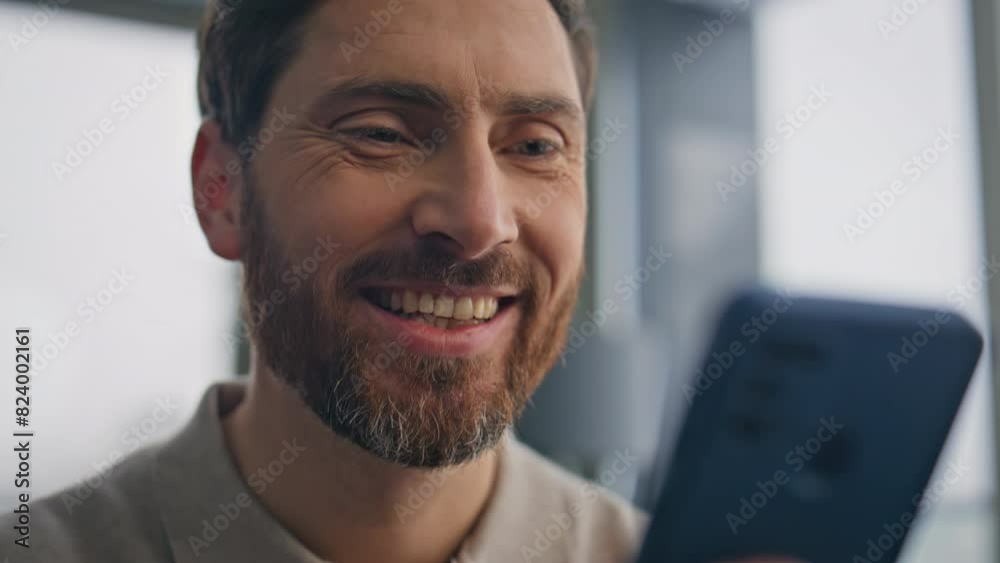 Bearded manager using mobile phone in morning closeup. Man hands typing screen