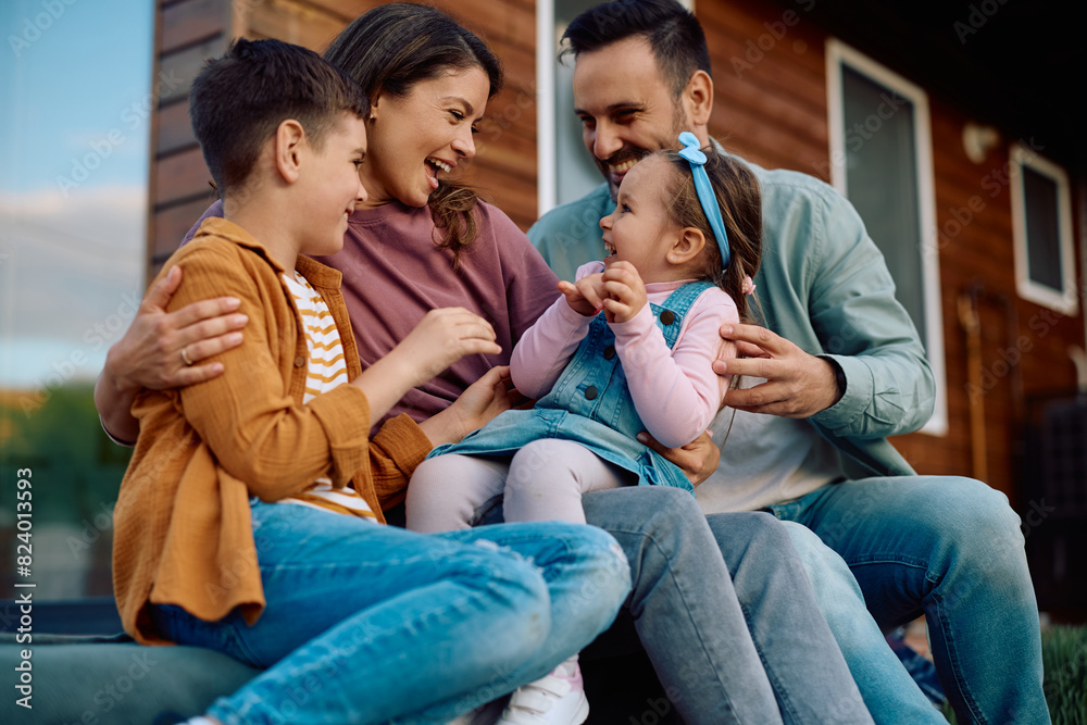 Cheerful family enjoying in their time together outdoors. Cheerful family enjoying in their time together outdoors.