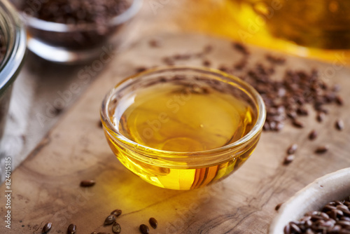 A bowl of flax seed oil with linseeds