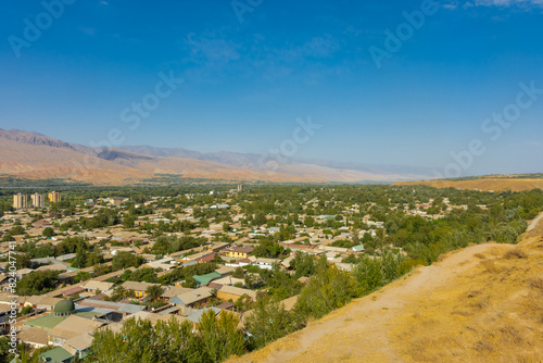 Cityscape of Panjakent with the Zerafshan mountains on the background,  city in Tajikistan photo