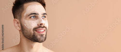 Handsome man with clay mask...