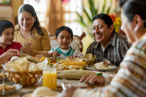Obraz na płótnie A Mexican family sharing laughter and stories around a table laden with tamales and tacos, embracing the joy of togetherness. Concept of cultural cuisine and familial warmth. Generative Ai. w salonie