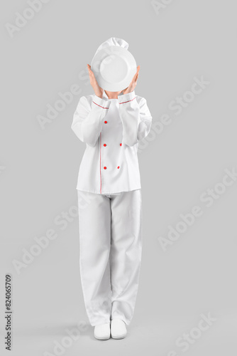 Female chef with empty plat...