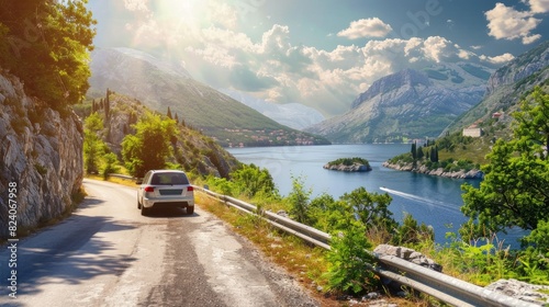 A scenic view of a car driving along a picturesque European road in the summer photo