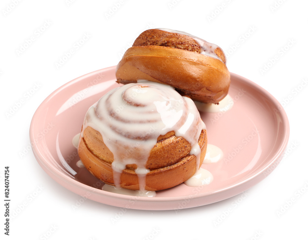 Plate with tasty glazed cinnamon buns on white background Plate with tasty glazed cinnamon buns on white background