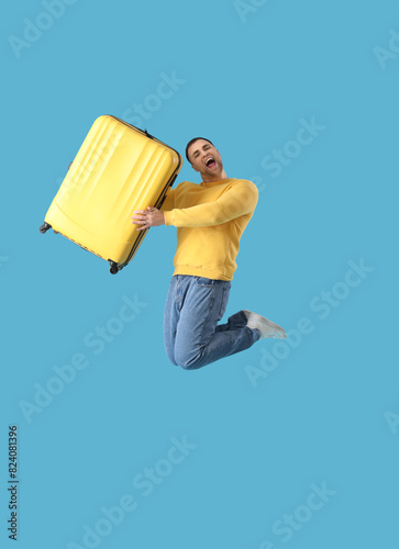 Cheerful male tourist jumpi...