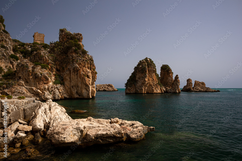 View of the famous Faraglioni , stacks of Scopello