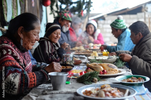 A group of people is gathered around a table  enjoying a festive meal together during Christmas in Mexico.